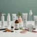 Clean beauty products with transparent ingredient labels on white surface