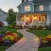 Professional landscaping transformation with lush green lawn and vibrant flower garden